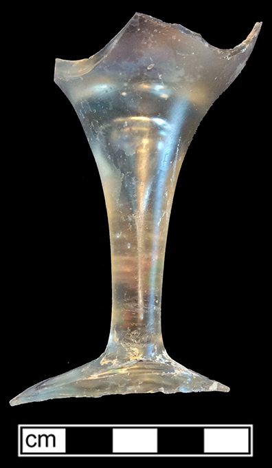 Colorless soda lime glass wine glass. Possibly ovoid bowl and teared plain straight stem. Roughly finished pontil